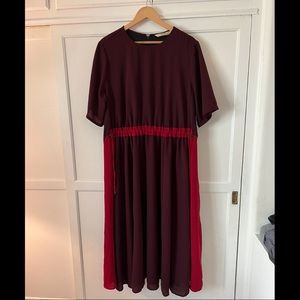 Burgundy Modest Midi Dress with Bright Red Skirt Inserts.